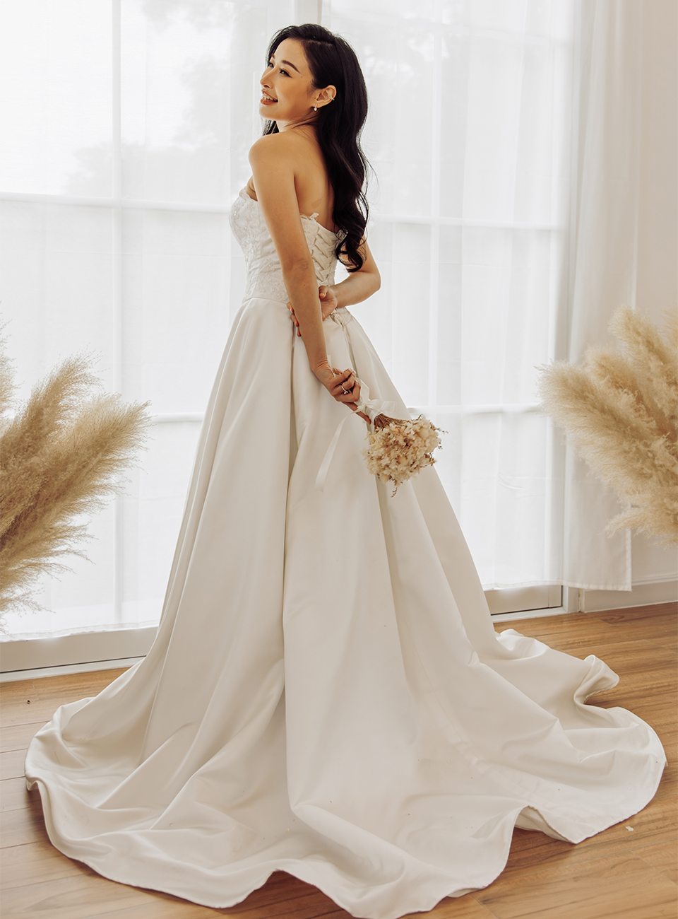 Bride standing in a white wedding dress