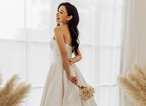 Bride standing in a white wedding dress